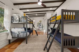a room with three bunk beds in it at Rancho del Plata in Tucson +64 photos