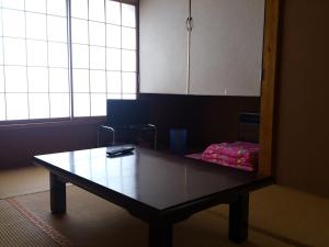 a coffee table in a room with a window at North Point Lodge in Minami Uonuma +11 photos