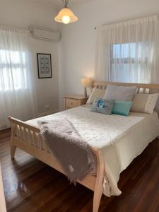 Ένα ή περισσότερα κρεβάτια σε δωμάτιο στο Family and pet friendly home in Brisbane +13 φωτογραφίες
