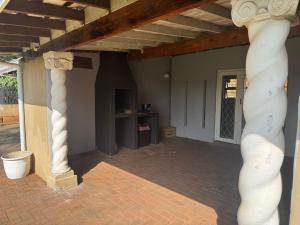 a room with two columns and a entry way at Casa Blanca Home in Kingsburgh