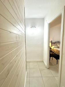a bedroom with a sliding closet door with a bed at VUT de uso turístico Las Palomas in Arenas de San Pedro +22 photos