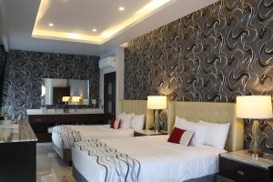 Postel nebo postele na pokoji v ubytování Hotel Wellintown