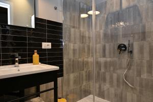 a bathroom with a sink and a shower at La Maison in Polla +47 photos