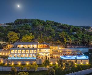 an aerial view of a hotel at night at Myzith Luxury Suites in Keri +37 photos