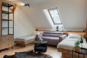 Postel nebo postele na pokoji v ubytování TrojHouse