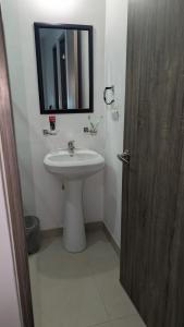 a bathroom with a sink and a mirror on the wall at Everest 663 in Monterrey +16 photos