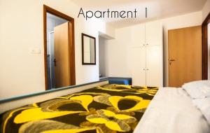 Posteľ alebo postele v izbe v ubytovaní Apartment Lopar 14804a