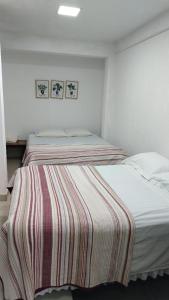 Postel nebo postele na pokoji v ubytování Stefanich Aparthotel 90