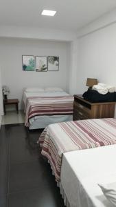 Postel nebo postele na pokoji v ubytování Stefanich Aparthotel 90