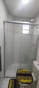 a bathroom with a shower with a toilet and a sink at Condomínio São Francisco in Petrolina