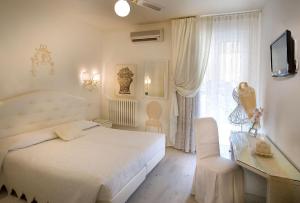 Posteľ alebo postele v izbe v ubytovaní Hotel Serenella
