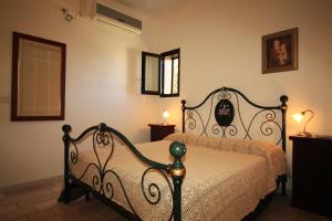 Postel nebo postele na pokoji v ubytování Trullo Sage by LoveSud