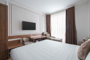 TV a/nebo společenská místnost v ubytování Dalat Roof Hotel