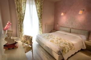 Posteľ alebo postele v izbe v ubytovaní Hotel Serenella