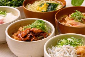 a group of bowls of food on a table at Hotel Green Park Tsu in Tsu