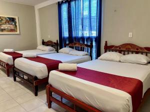 Postel nebo postele na pokoji v ubytování Casa Vidal Hotel