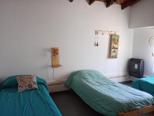 Postel nebo postele na pokoji v ubytování Los Gurises