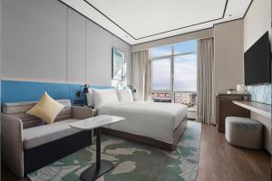 TV a/nebo společenská místnost v ubytování Hilton Garden Inn Beijing Yizhuang