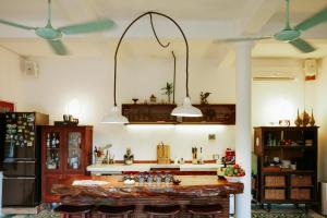 a kitchen with two lights hanging from the ceiling at Heron House in Hoi An