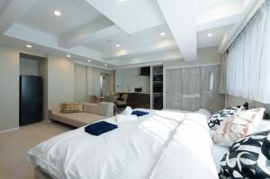 Ένα ή περισσότερα κρεβάτια σε δωμάτιο στο ENT TERRACE GINZA Premium