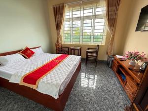 Letto o letti in una camera di Hồng Ngọc 2 Hotel Tà Đùng