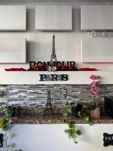a shelf with a sign that says paris and the eiffel tower at Hotel Paris in Tijuana