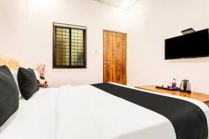 TV a/nebo společenská místnost v ubytování Super Hotel O Pardi Near Kalamna Market