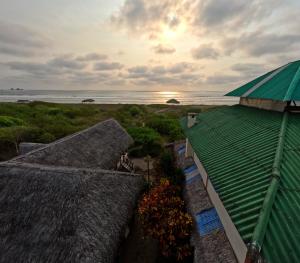 a view of the ocean from the roof of a resort at La Perla Hostel and Cabins in Las Tunas