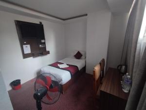 Rúm í herbergi á Hotel De Universal