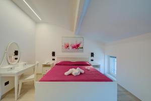 Postel nebo postele na pokoji v ubytování Magnolia Apt - Palazzo Palermo 1817 - Happy Rentals + 11 fotografií