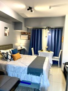 Ένα ή περισσότερα κρεβάτια σε δωμάτιο στο Horizons 101 Residential Condominium +12 φωτογραφίες