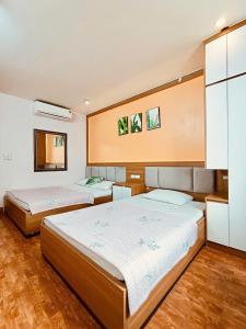 Postel nebo postele na pokoji v ubytování Sao Mai Hotel HN - by BAY LUXURY