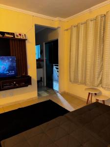 TV a/nebo společenská místnost v ubytování Escape Para o Paraíso