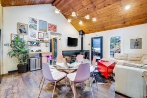 a dining room and living room with a table and chairs at Artsy Retreat - Woodstove Grill and Patio in Guerneville