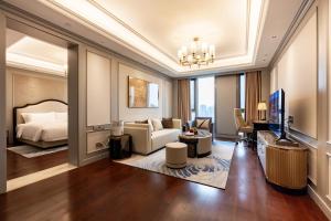 Posezení v ubytování Jian Guo Hotel Yantai Phoenix Building