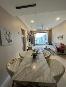 a living room with a long table and chairs at Luxury Apt close to KLCC Aria in Kuala Lumpur +54 photos
