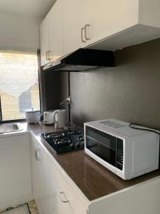 Kuchyň nebo kuchyňský kout v ubytování Happy staycation