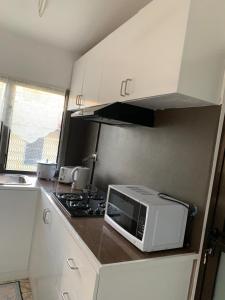 Kuchyň nebo kuchyňský kout v ubytování Happy staycation
