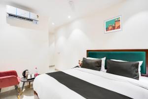 Postel nebo postele na pokoji v ubytování Hotel O Ivory Inn + 37 fotografií