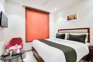 Postel nebo postele na pokoji v ubytování Hotel O Ivory Inn