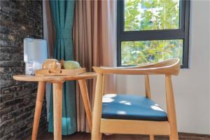 Зображення з фотогалереї помешкання Huangliang Yimeng Designer Hotel Wuzhen Xizha Scenic Area Branch у місті Tongxiang