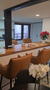 a kitchen and dining room with a large table and chairs at Wild House in Sinaia +22 photos
