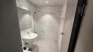 Koupelna v ubytování Elegance hotel hwangridan