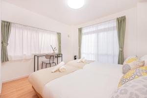 Una cama o camas en una habitación de Jone叙園商店街近隣駅徒步5分 新宿12分