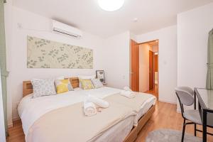Una cama o camas en una habitación de Jone叙園商店街近隣駅徒步5分 新宿12分