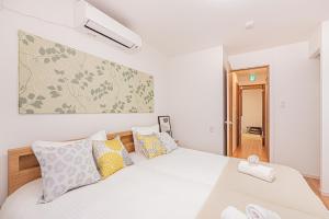 Una cama o camas en una habitación de Jone叙園商店街近隣駅徒步5分 新宿12分