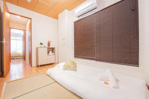 Una cama o camas en una habitación de Jone叙園商店街近隣駅徒步5分 新宿12分