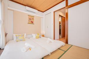 Una cama o camas en una habitación de Jone叙園商店街近隣駅徒步5分 新宿12分