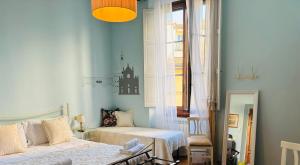 A bed or beds in a room at Affittacamere Firenze in Libertà Parterre