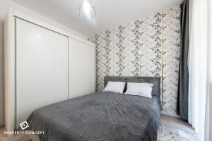 Ένα ή περισσότερα κρεβάτια σε δωμάτιο στο Ivory Concept Apartment 18